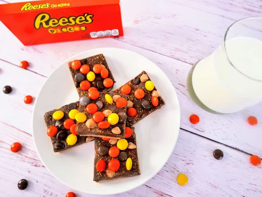 5 squares of Chocolate Peanut Butter Fudge Reeses Pieces Bars