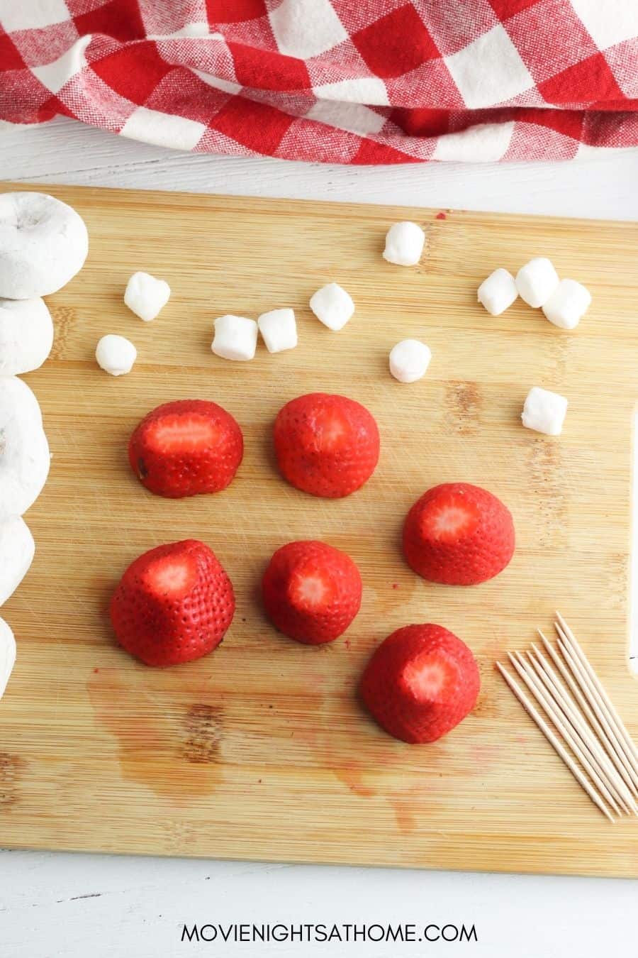 You'll need strawberries, mini marshmallows and mini powdered donuts