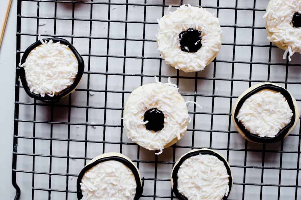 step 3 is adding black icing to the cookies