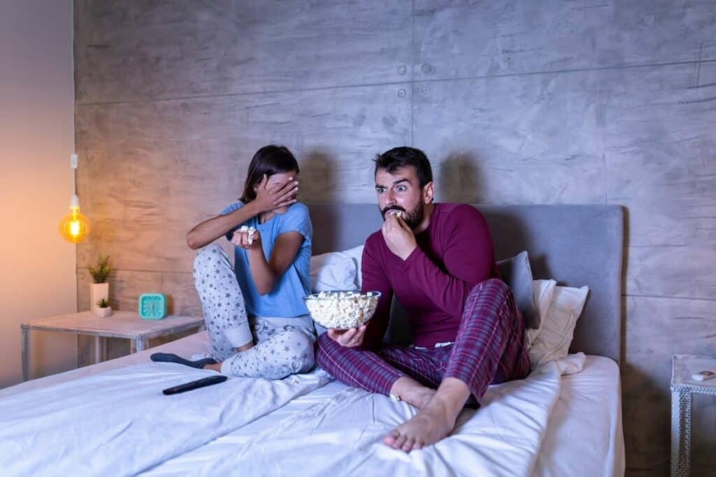 couple watching a movie with popcorn