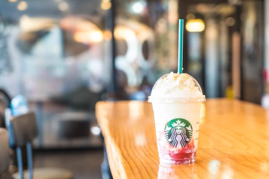 gryffindor starbucks drink on a table in a cafe