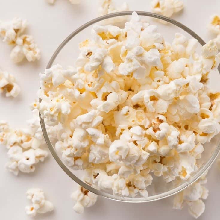 popped popcorn in a glass bowl