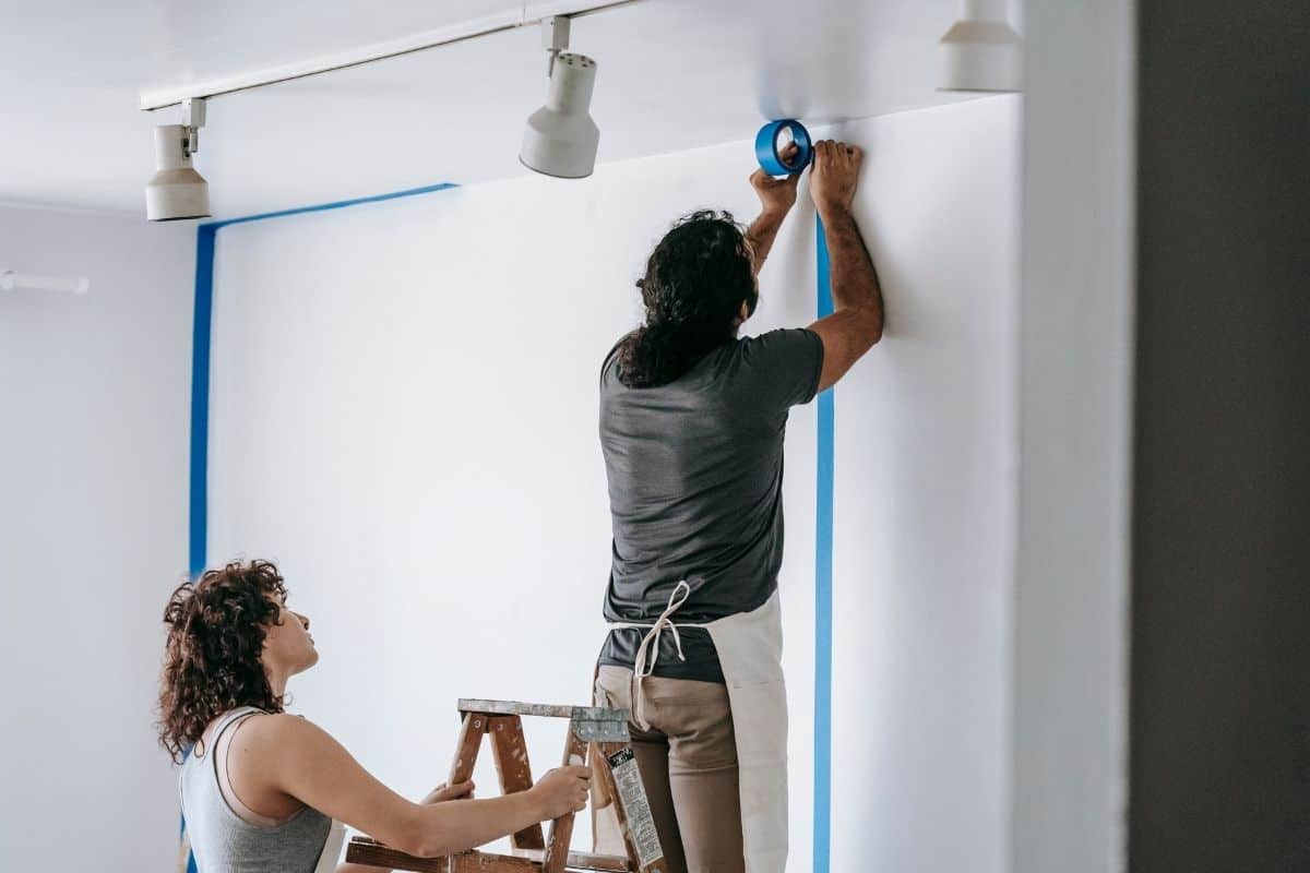 a couple painting their movie projection room