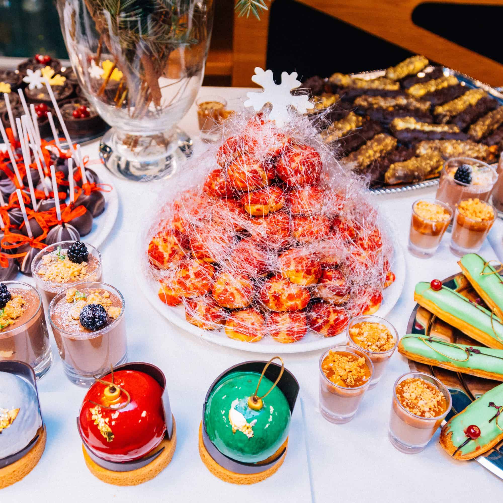 table of assorted fancy Christmas desserts