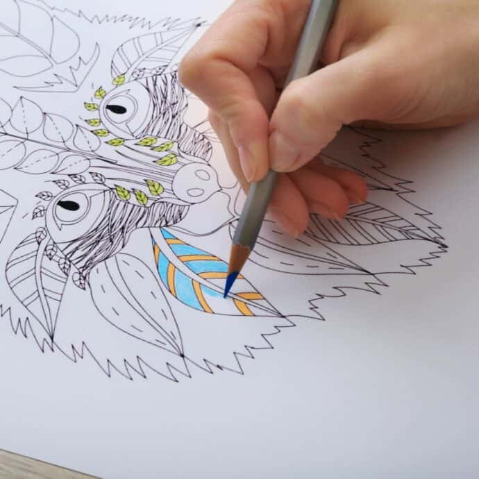 close up of someone coloring a coloring sheet
