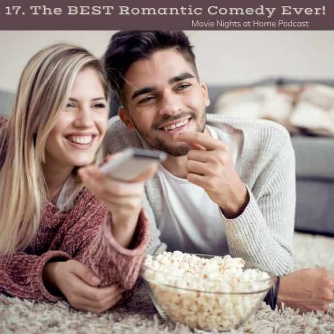 couple eating popcorn laying on bed watching tv