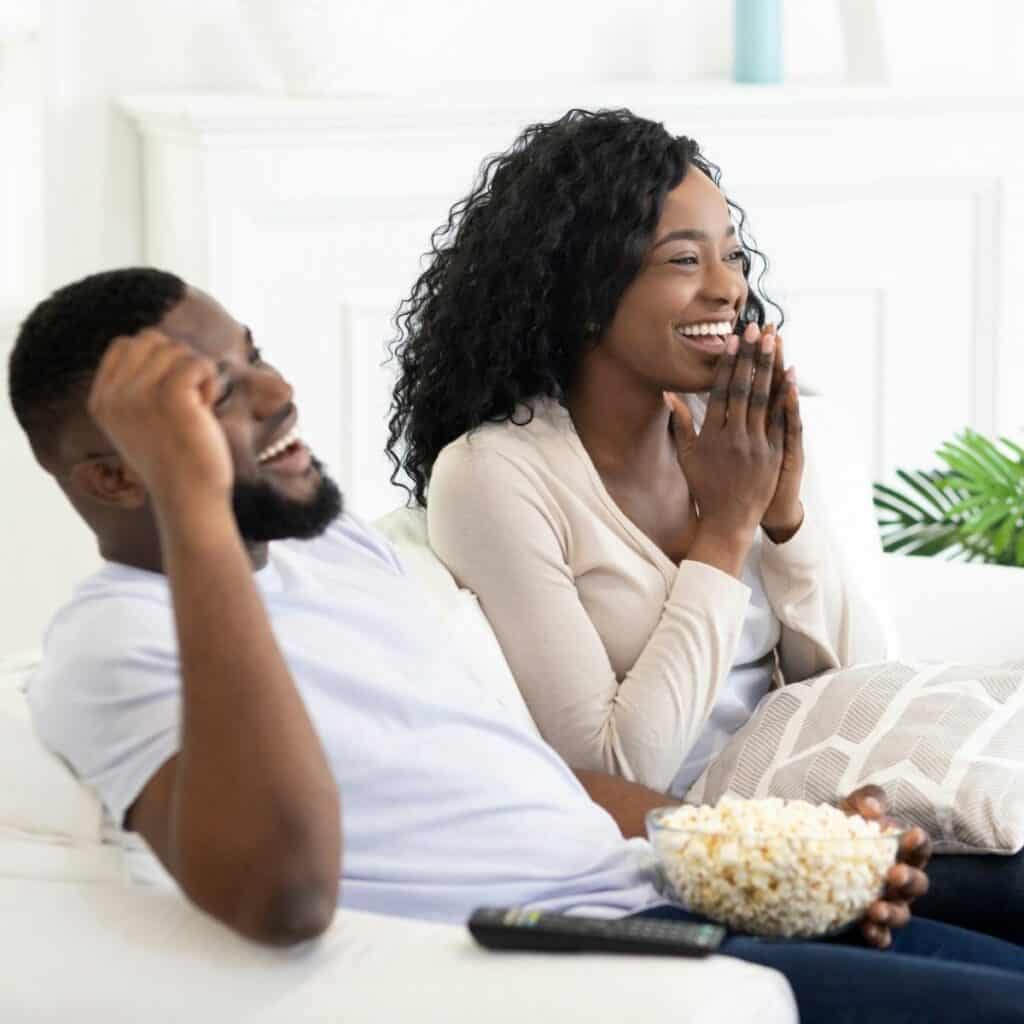 black couple watching a movie