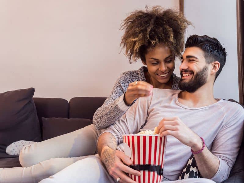 couple sharing popcorn