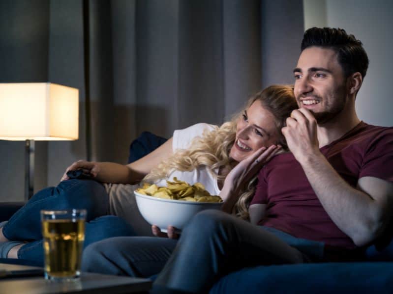 couple watching a movie on the couch