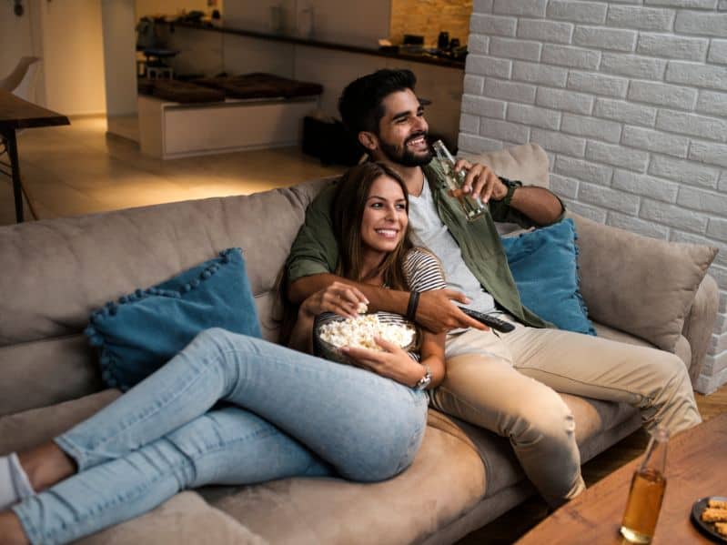 couple watching movie on the couch