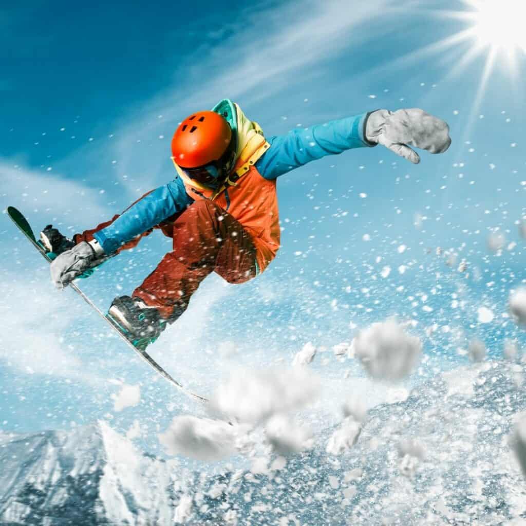 person doing a jump on a snowboard