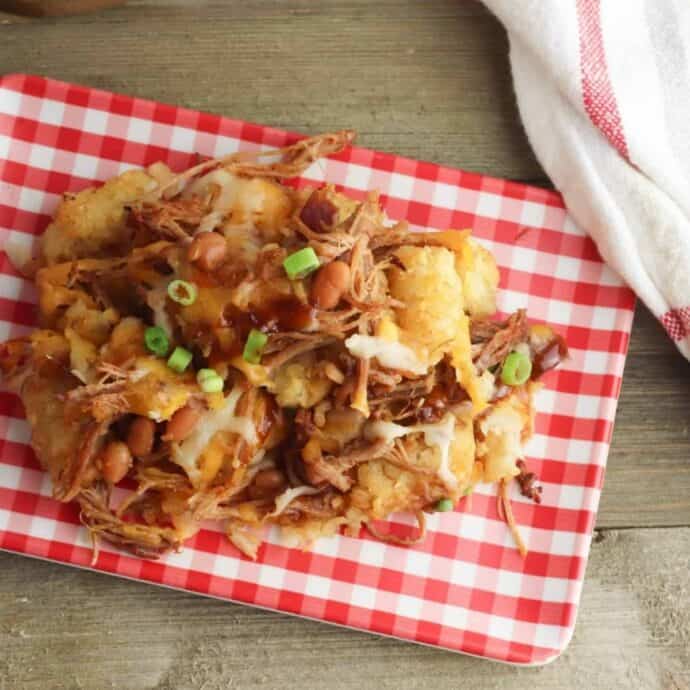 pulled pork casserole recipe on a red and white plate