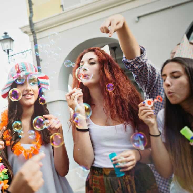 teens blowing bubbles