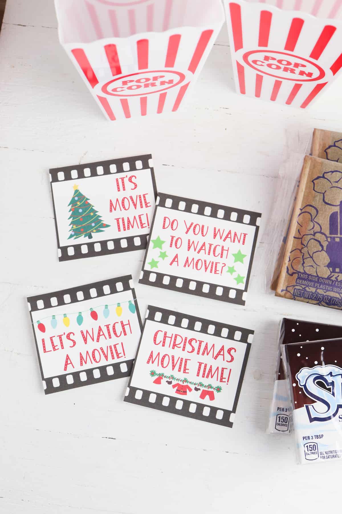 the printable cards, popcorn holders, and snacks