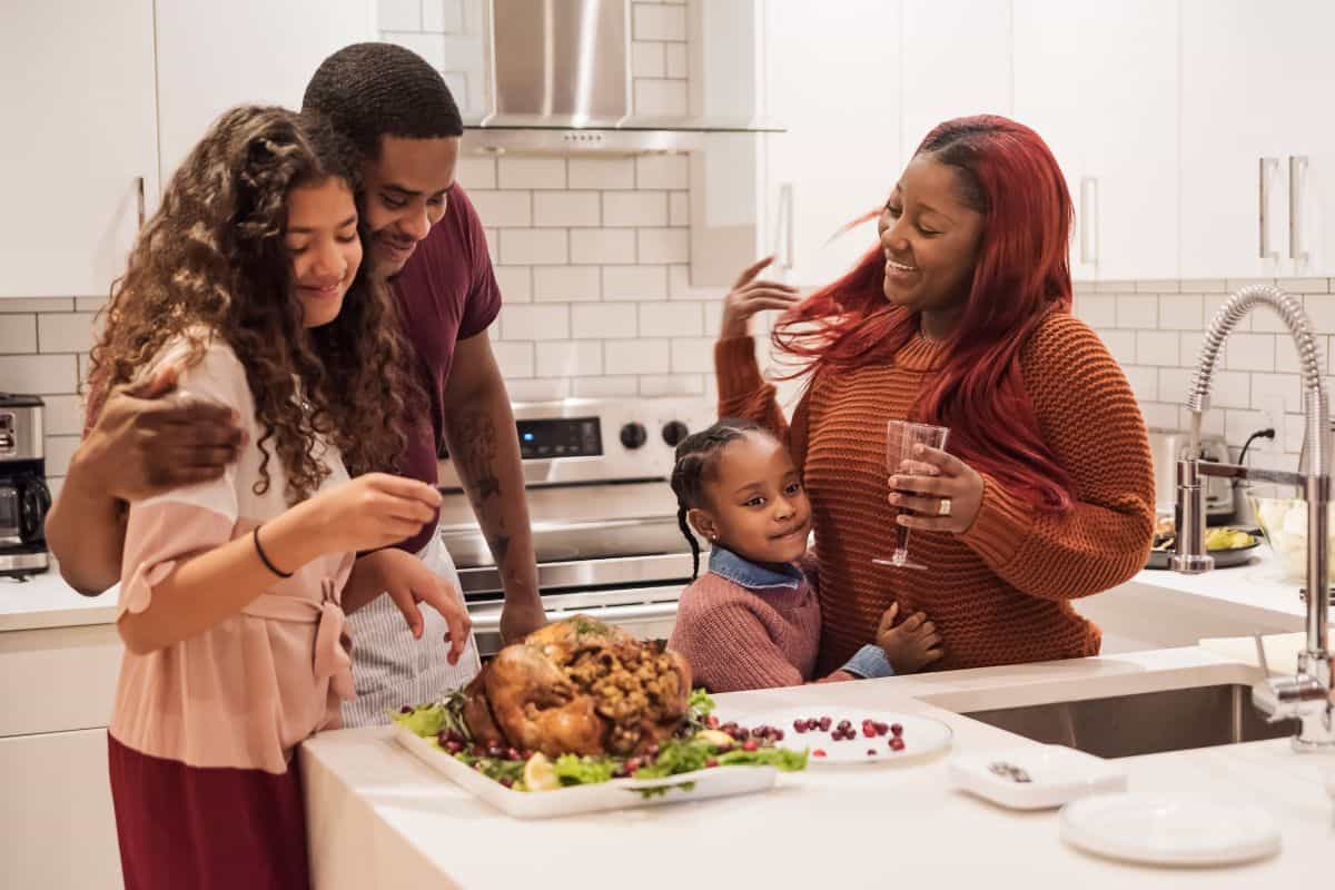 family after Thanksgiving dinner in the kitchen