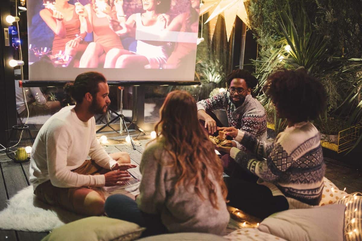 family and friends watching the best thanksgiving movies for kids after dinner