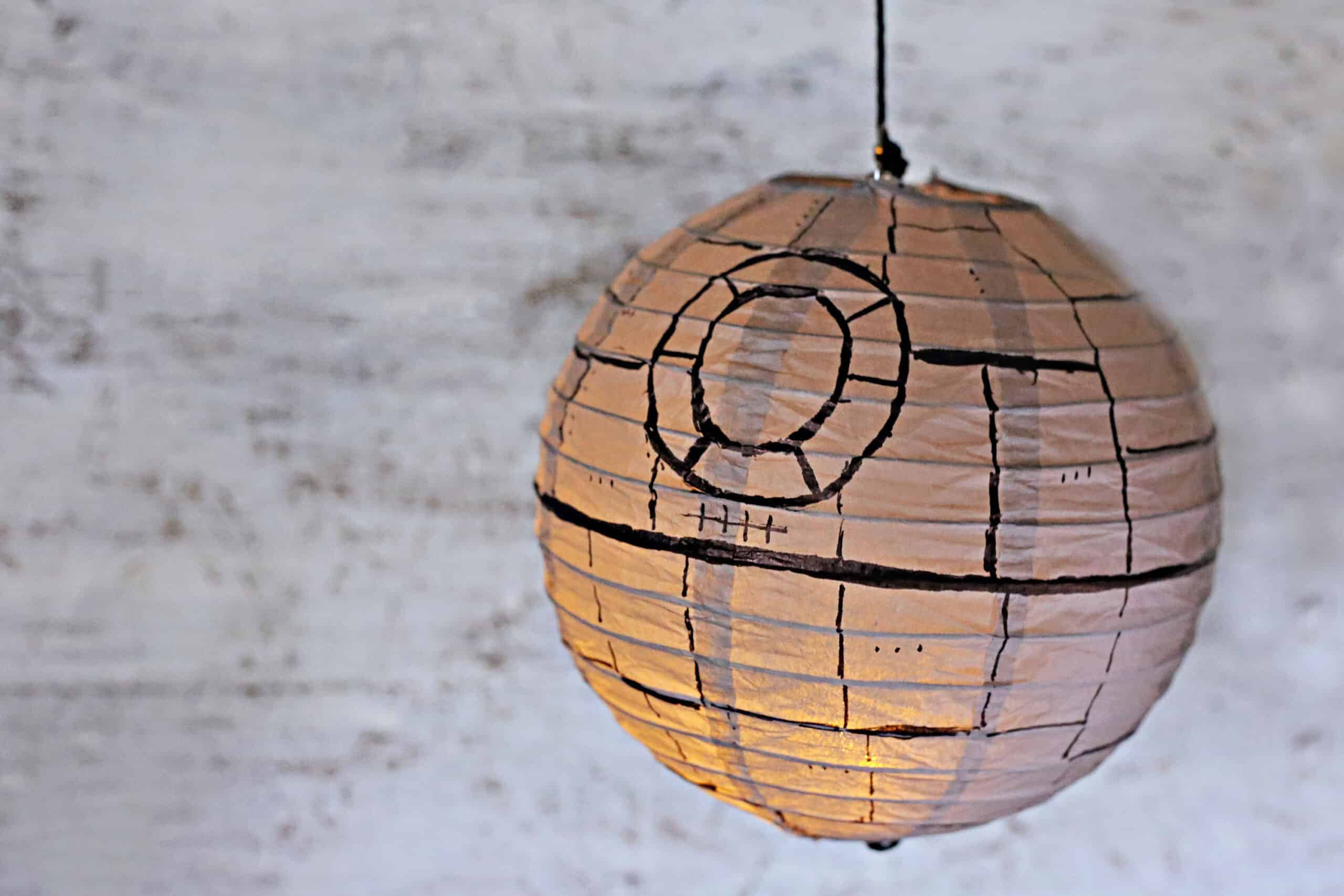 DIY Death Star Craft paper lantern lit up like a nightlight