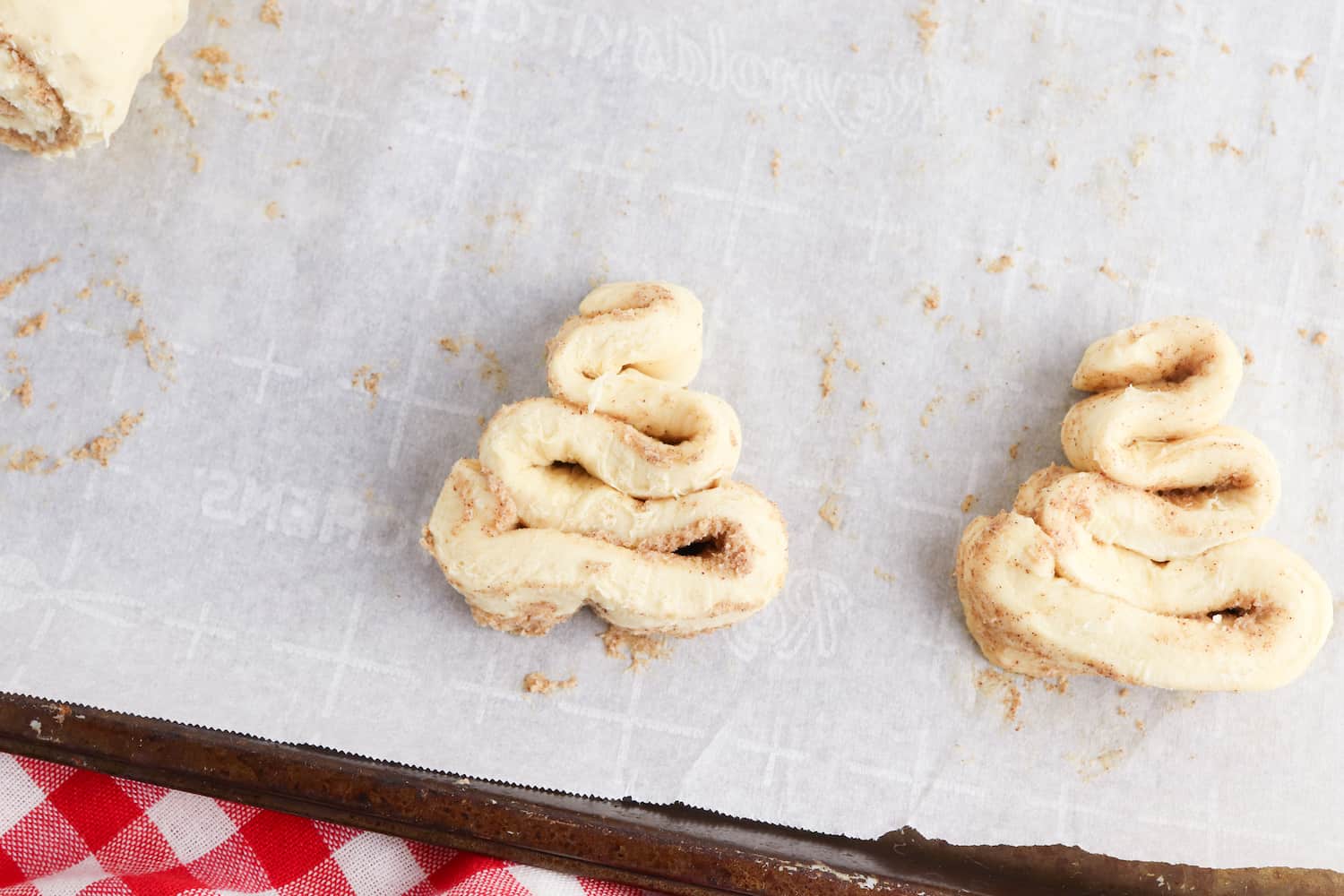 cinnamon roll dough in the shape of a triangle