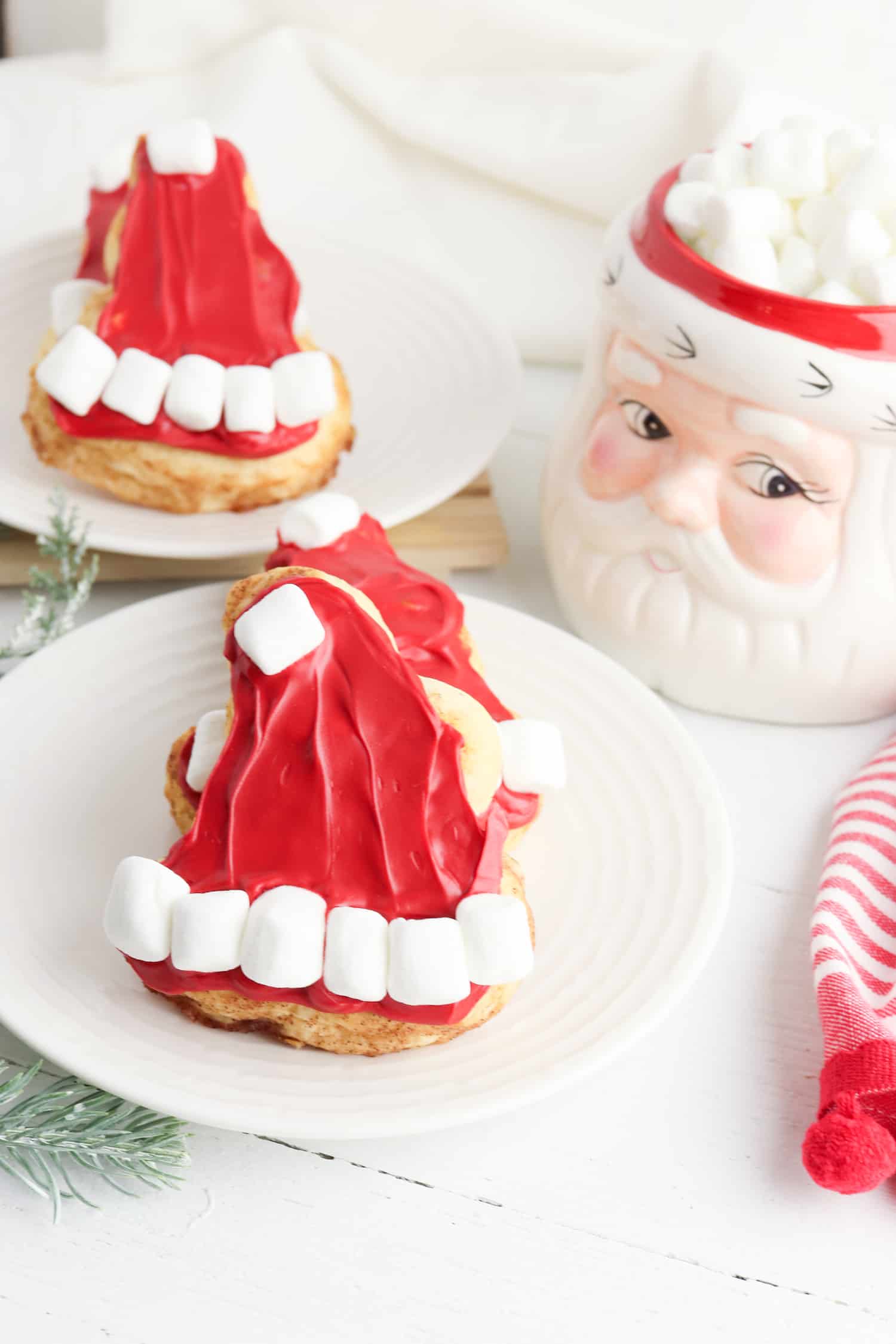 Christmas morning cinnamon rolls in the shape of a Santa hat