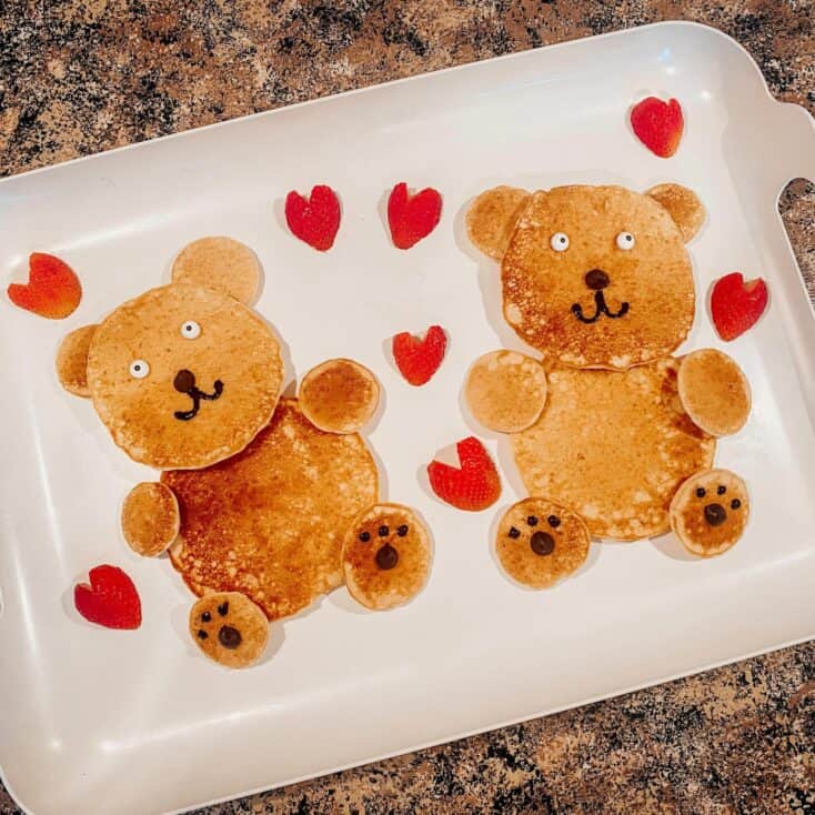 2 teddy bear pancakes with heart shaped strawberries - Valentines Day Breakfast Pancakes for Kids