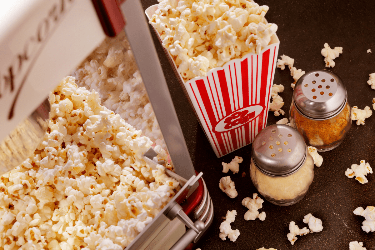 bucket of popcorn and seasonings shot from above