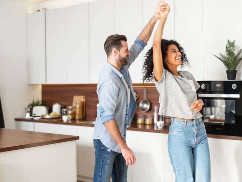 couple dancing in the kitchen