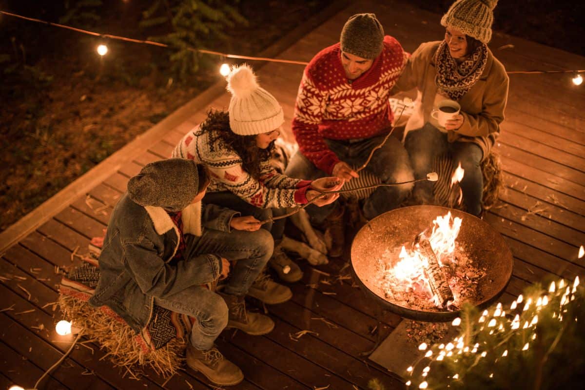 friends around a fire in the winter