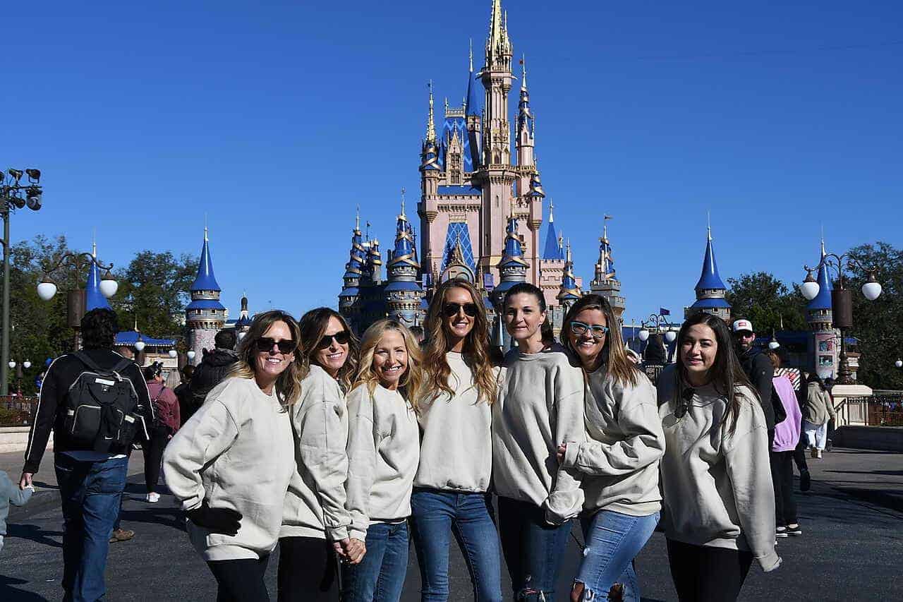 Group of friends outside Cinderella's Castle at Disney World Magic Kingdom Park