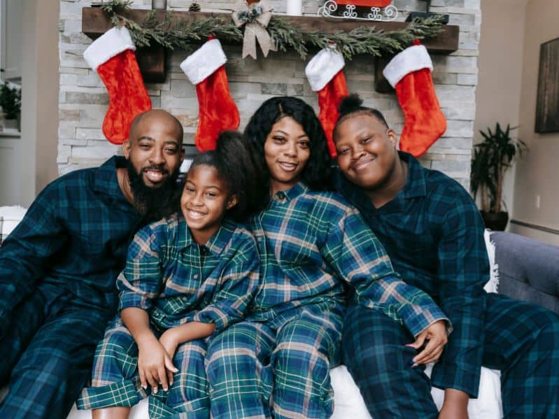 Black family in Christmas pajamas